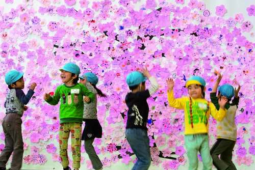 Young nursery school children play in the Red Cross 'Smile Park'- a children's play facility set up to give Fukushima children, whom can't play outdoors due to fears of radiation, somewhere to have fun, in Fukushima city, in Fukushima prefecture, Japan, o