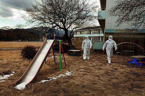 Police Sergeant Yabuki Koshin (27yrs, wearing glasses, driving police car) and Constable Kanno Tomoyasu (20yrs) take a walk around the ground of Obori Kindergarten whilst on patrol in Namie town, within the evacuated, and now uninhabited 20km exclusion zo