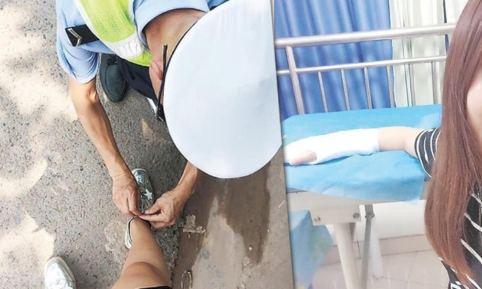 ตำรวจจีนถูกยกย่อง ก้มผูกเชือกรองเท้าให้สาวข้อมือหัก