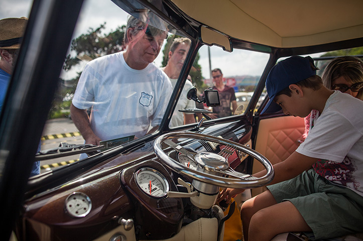 Visitors inspects the interior of a custom Volkswagen Kombi minibus