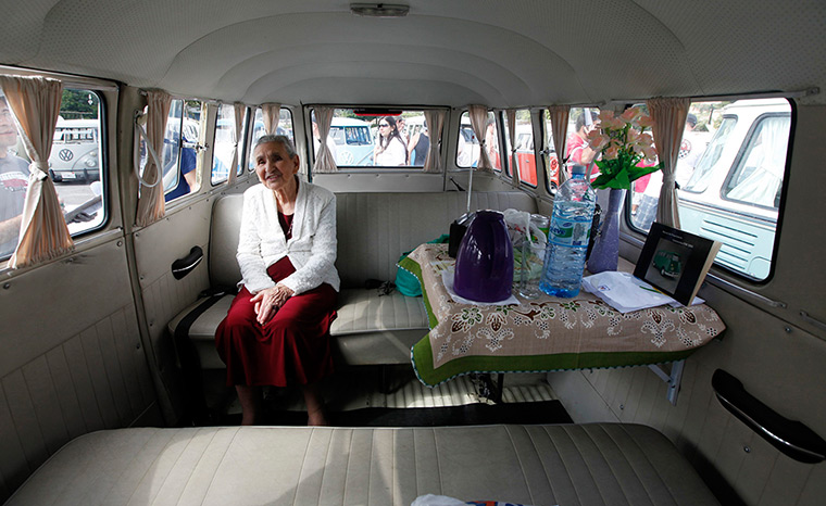 Marcilia Coelho sits inside her van