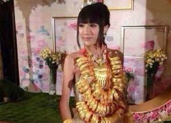 หวือหวา! เจ้าสาวจีนใส่ทอง หลายสิบกิโลเข้าพิธีแต่งงาน