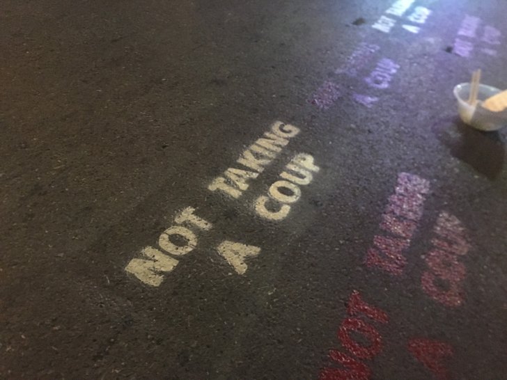 Fumigation Message: Protesters spray paint as anti-coup messages in English that say Do not hit the street at Lad Phrao intersection.  During the meeting on November 27, 2020