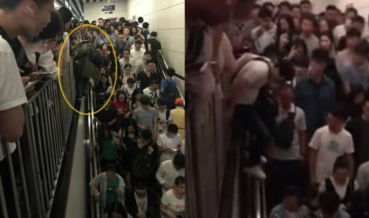 ผู้โดยสารปีนราวกั้น หลังบันไดเลื่อนในสถานีรถไฟใต้ดินปักกิ่งพัง คนค้างแน่น