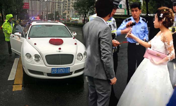 วิวาห์ชะงัก ตำรวจกักตัวบ่าวสาวจีน ขึ้นรถหรูป้ายทะเบียนปลอม
