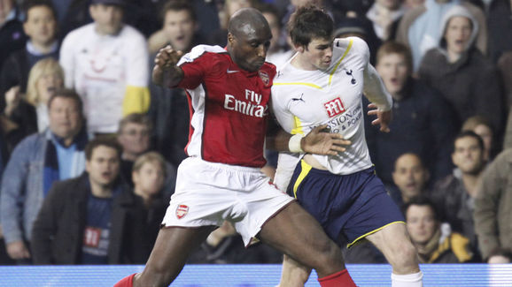Arsenal's Sol Campbell (L) challenges To