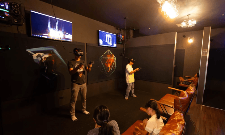 People standing and wearing VR goggles