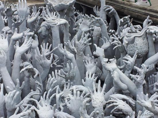 Outreaching hands that symbolize unrestrained desire.