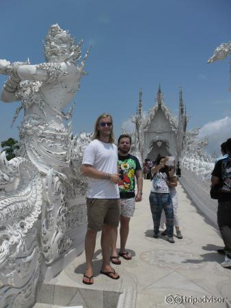 The bridge leading to the temple with two giant grim reaper figures on either side.