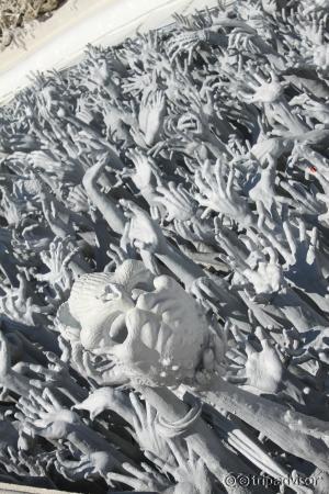 sea of hands in hell at white temple