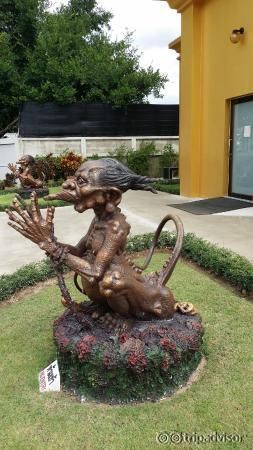 Male genie guading male toilet.  Notice the shit at its rear.