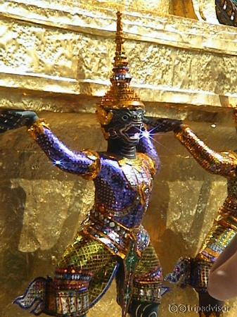 Glistening monkey gods holding up gold stupas.