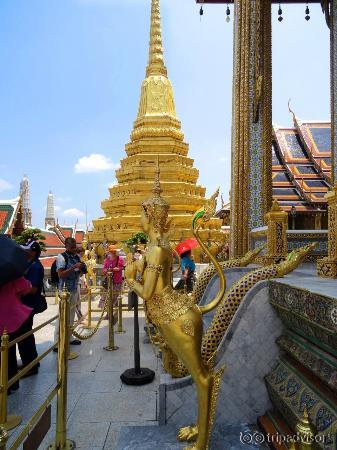 Golden guards outside the Temple of the Emerald Buddha