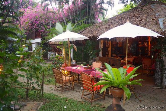 Dining area next the the lounge filled with books.