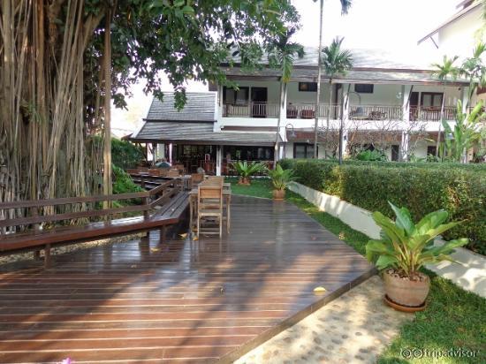 View of walkway adjacent to pool and leading to restaurant