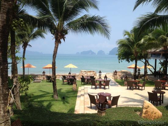 view from the pool out towards the private beach and distant islands
