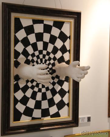 Hands out of the painting