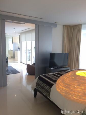 looking from bedroom out to lounge and kitchen area and looking towards balcony