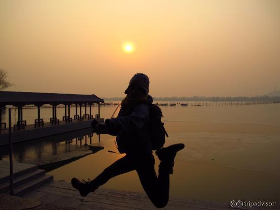 Jumping for joy in front of the summer palace lake!