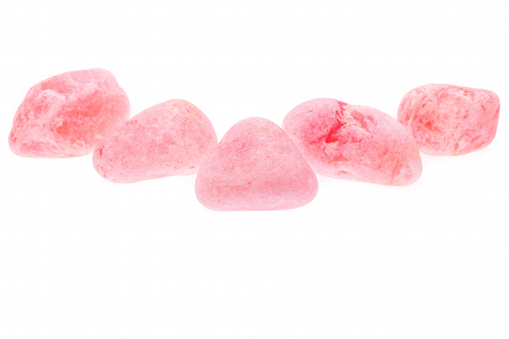 Several rough pink rose quartz isolated