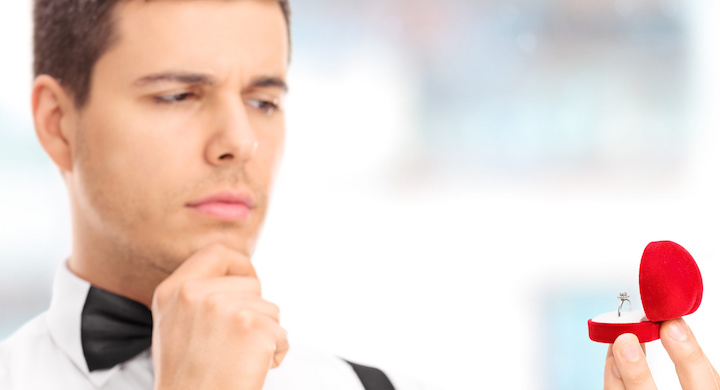 Man choosing an engagement ring in a jewelry store