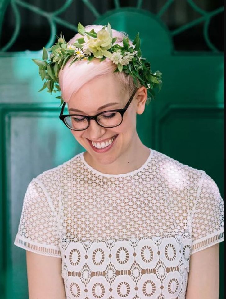 Pink pixie cut with flower crown wedding day hairstyle