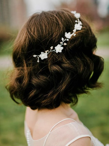 Short bob wedding hairstyle with a jeweled flower crown