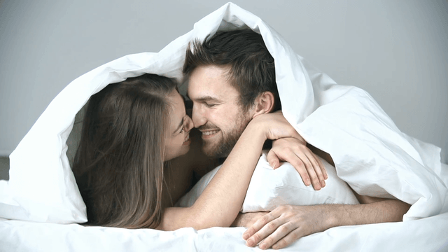 1524195765 close up of sweet couple cuddling in bed 4yglioe   f0000